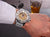 A man's wrist shot lifestyle photo of  showcasing his automatic Barcelona watch.